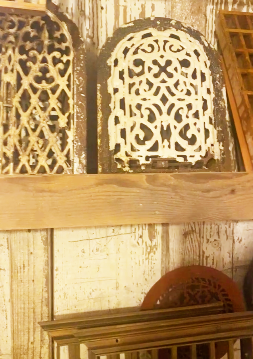 Finding artistic inspiration in antique stores by looking at items that have a story like these aged decorative grate covers. 